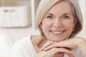 Portrait of an attractive elegant senior woman relaxing at home